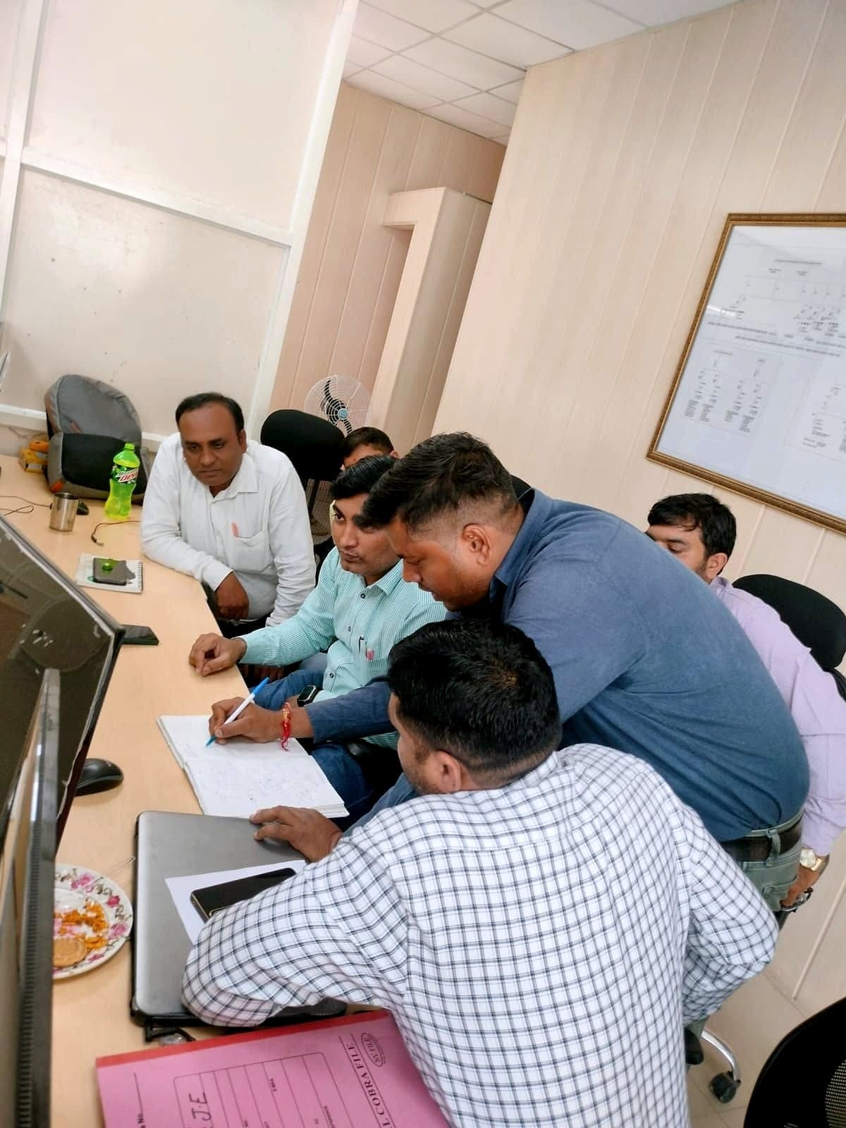 TBR engineers reviewing a single-line diagram during commissioning